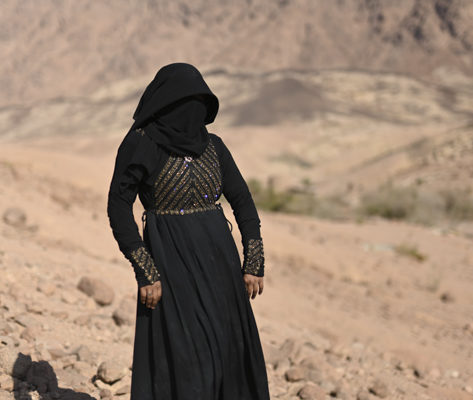 Hoda (23) from St. Catherine city stands on the edge of a hill looking over Gharba Valley. April 2019.